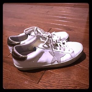 Size 8 women’s Golden Goose sneakers.